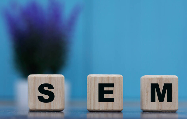 SEM(Search Engine Marketing) - word on cubes on a blue background with lavender. Internet concept - Φωτογραφία, εικόνα