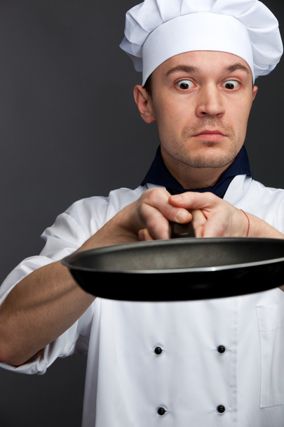 Supsised chef holding pan - Valokuva, kuva