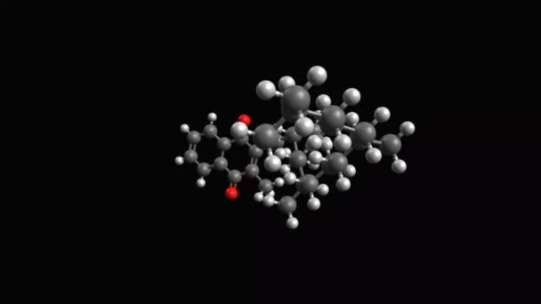 K1-vitamin (filokinon) animált gömb- és pálcikamodellje, fekete háttér - Felvétel, videó
