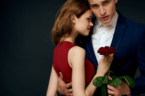 luxury couple hug romance relationship rose over dark isolated background - Fotografie, Obrázek