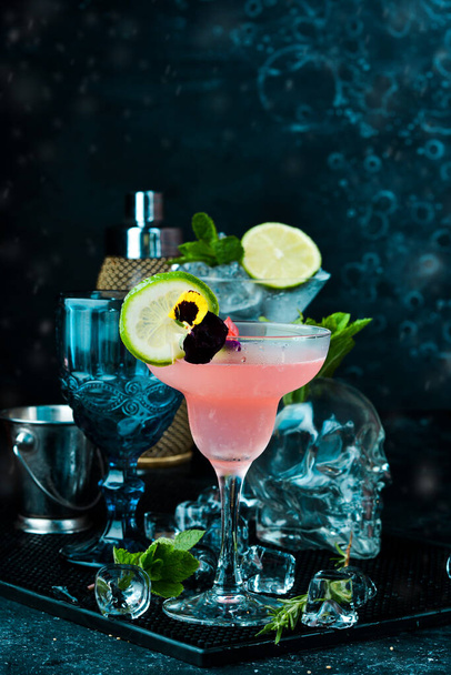 Strawberry alcoholic drink in a glass Margarita. On a black stone background. Menu bar. - Φωτογραφία, εικόνα