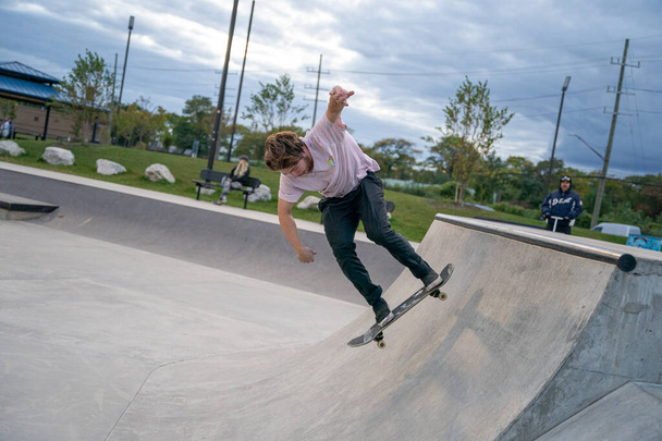 skaters are practicing tricks in an outdoor skate park in Detroit Michigan - Photo, Image