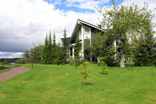 View of cottage in village in summer, Karelia - Foto, afbeelding