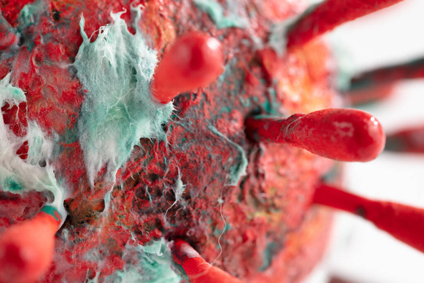 An abstract macro photograph of a colorful virus sculpture. The artwork inspired by the Covid-19 lockdown of 2020 - Photo, Image
