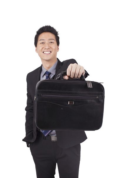 Businessman holding portfolio - Foto, Imagem