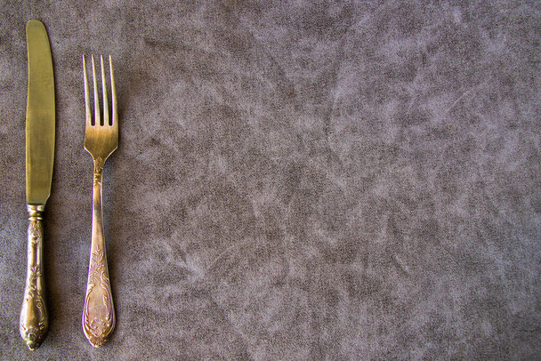 Tableware and dishware setting, folk and knife on the gray background - Φωτογραφία, εικόνα