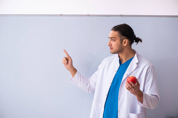 Young male doctor in presentation concept - Photo, Image