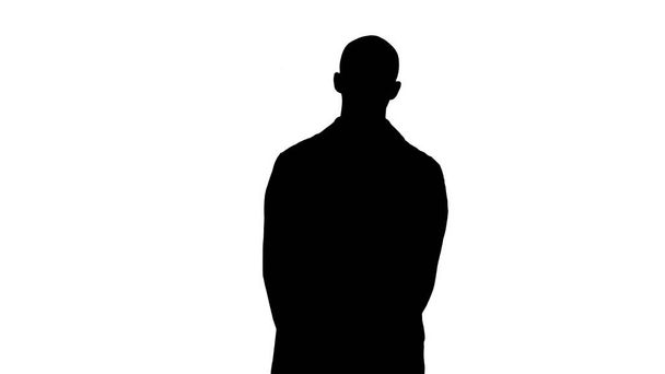 Silhouette Doctor man is a little bit nervous and scared standing. - Photo, Image