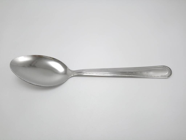 Stainless steel metal eating utensil spoon use for eating food meal - Fotó, kép