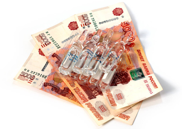 ampoules with medicines and a lot of paper Russian rubles - 写真・画像