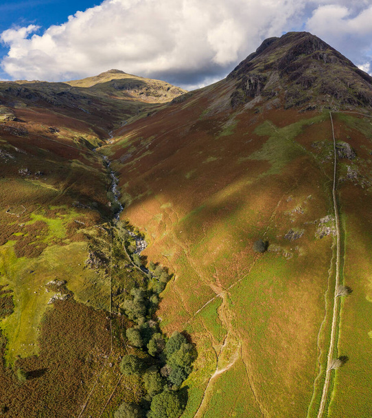 Stunning high point of view from flying drone over Lake District landscape in late Summer, in Wast Water valley with mountain views - Photo, Image