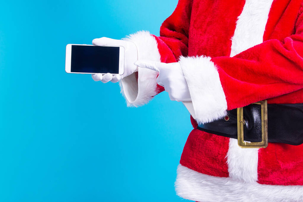 Santa Claus showing his mobile phone - Foto, Imagem