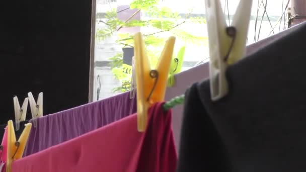 Cloth hanging clips with fabric and rope and several of them - Footage, Video