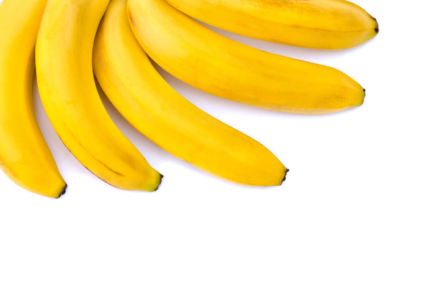 Banany na białym tle. Widok z góry, płaski - Zdjęcie, obraz