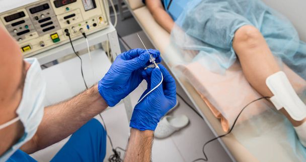 Cardiologist use tubes for radiofrequency catheter ablation. - Φωτογραφία, εικόνα