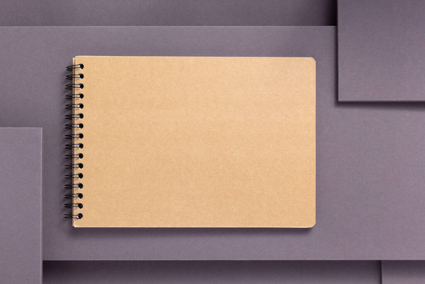 notebook or notepad at abstract grey paper background, minimalism concept style - Foto, Imagen