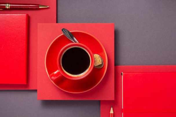 notebook with pen and cup of coffee at abstract grey paper background, minimalism concept style - Foto, Imagem