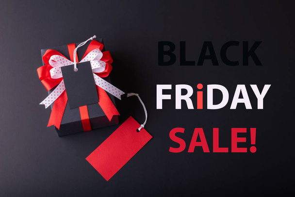 Black Friday sale concept. Red Sale tag  and Black Sale tag color on the black background with Copy space. Black Friday weekend - Zdjęcie, obraz