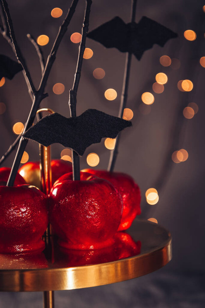  Red apples in caramel - Halloween sweets homemade. High quality photo - Zdjęcie, obraz