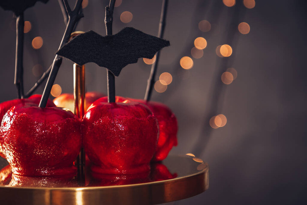  Red apples in caramel - Halloween sweets. Free space for text. High quality photo - Φωτογραφία, εικόνα