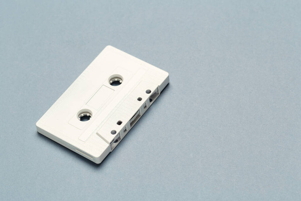 One single retro audio cassette on light grey background, top view - Zdjęcie, obraz