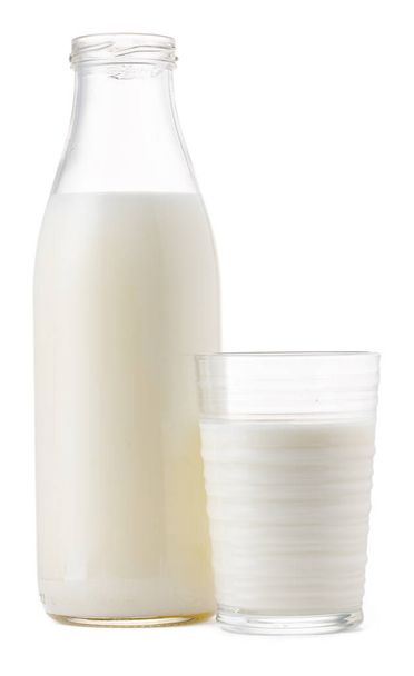 Glass cup and bottle of fresh milk isolated - Photo, Image