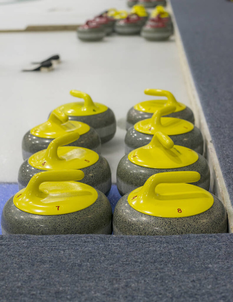 lifestyle, cold, competition, curling, game, granite, group, handle, ice, indoors, leisure, match, recreation, red, rink, rink ice, rock, sheet, sport, stone, strategy, team, winter - Photo, Image