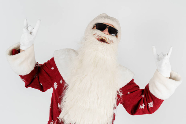 Christmas and New Years concept. Santa Claus shows a gesture by raising up two fingers on two hands. Isolated background. - Photo, image