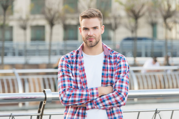 Confident in his choice. casual dressed person relax in city outdoor. Caucasian male resting in street. modern life concept. Young man in checkered shirt. businessman standing outdoor - Fotoğraf, Görsel