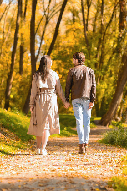 Two walking lovers having romantic date at forest - Photo, Image