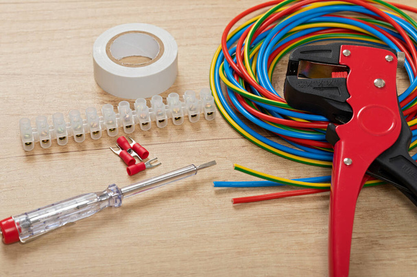 Tools for electrician needs: wire strippers, pliers, cables - Фото, изображение