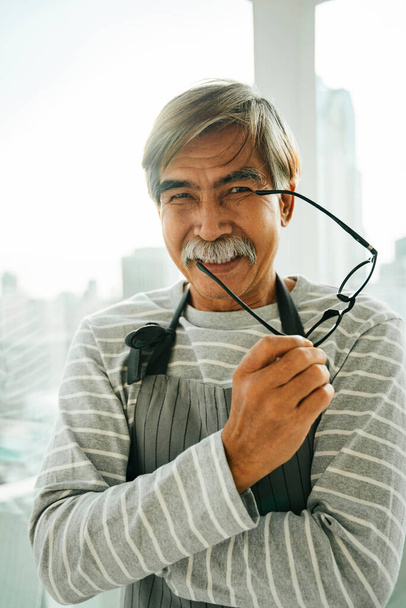 Portrait of old elderly senior waiter with eyeglasses in restaurant. - Zdjęcie, obraz