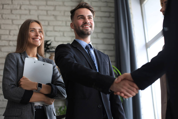Business people shaking hands, finishing up a meeting - Фото, зображення