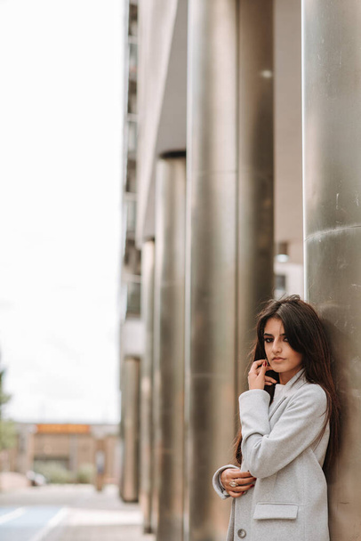A vertical shot of an Asian young woman posing in the street - Fotografie, Obrázek