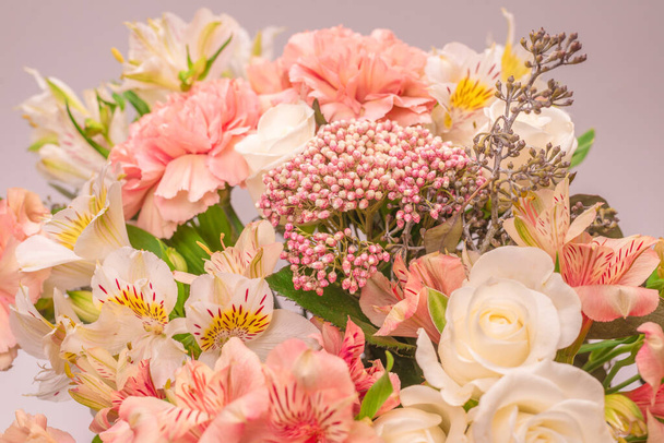 Bouquet of  soft pink flowers in pink wrapping paper.  - Photo, Image