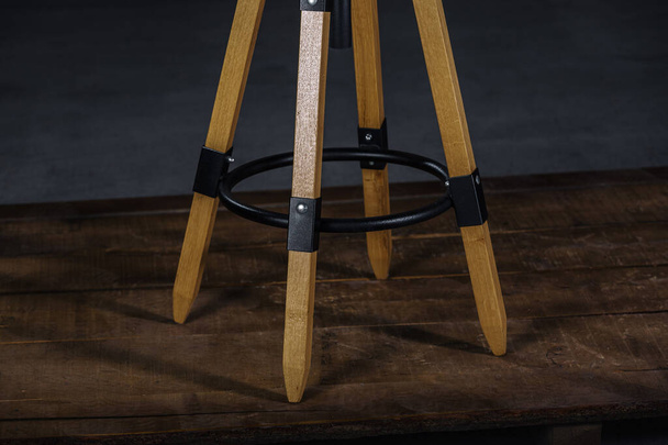 A tall wooden stool in a studio - Zdjęcie, obraz