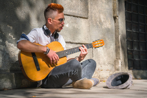 Portrait of street musician guitar player. Music, art, creativity concept. - Foto, Imagem