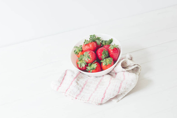 A delicious strawberry bowl on a cloth - Fotoğraf, Görsel