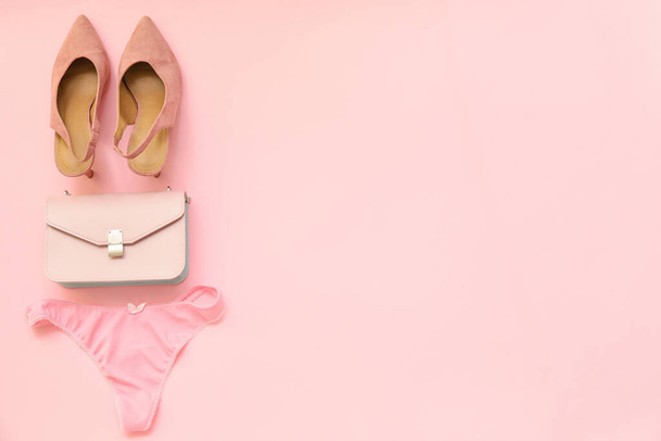 Stylish female panties with shoes and bag on color background - Photo, Image