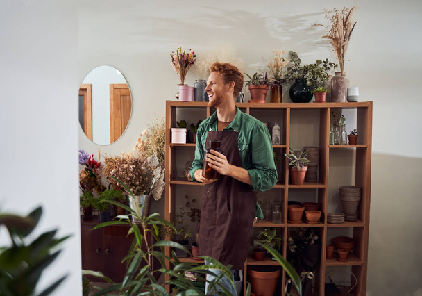 Handsome red head florist - Photo, Image