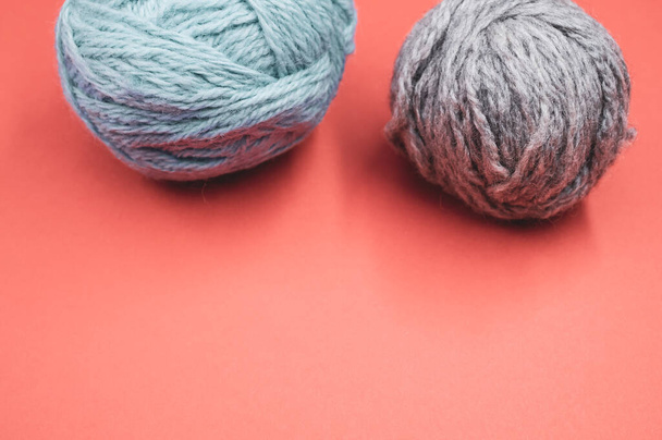 Two wool and cotton yarns on an orange background - Fotografie, Obrázek