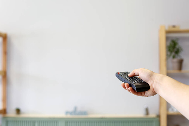 Young woman watching TV at home - Foto, Imagem