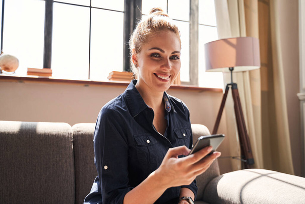 Happy young woman with gadget at home - Foto, Imagen