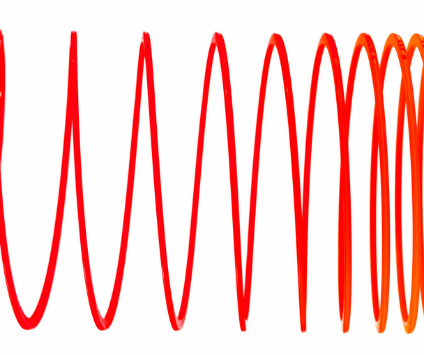 Monivärinen Slinky eristetty valkoisella taustalla - Valokuva, kuva