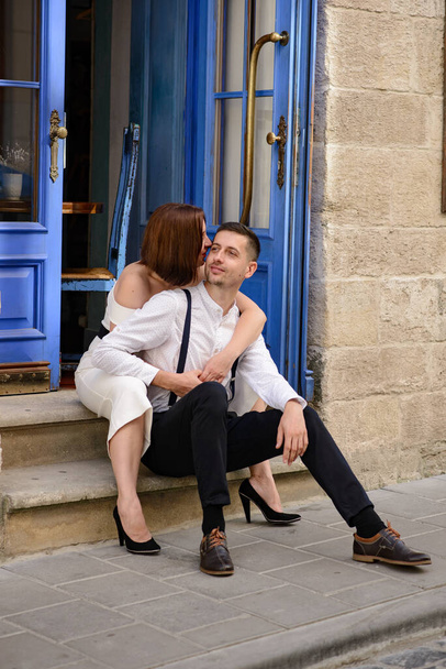 Beautiful stylish couple on a date on the streets in the old city. - Zdjęcie, obraz