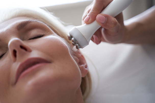 Woman face on anti-aging treatments in beauty clinic - Zdjęcie, obraz