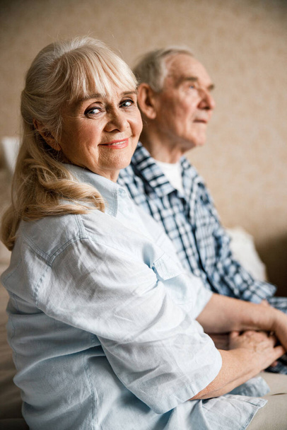 Hands of senior couple being held together - 写真・画像