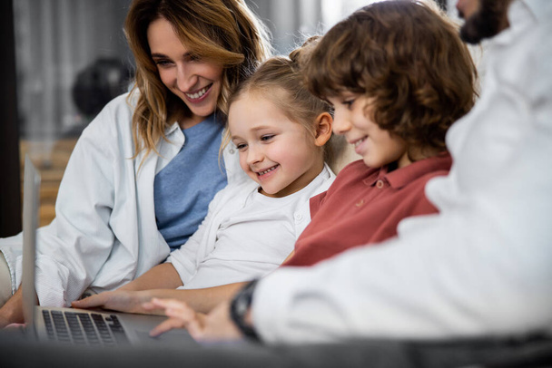 Family watching a kind movie on laptop - Photo, Image