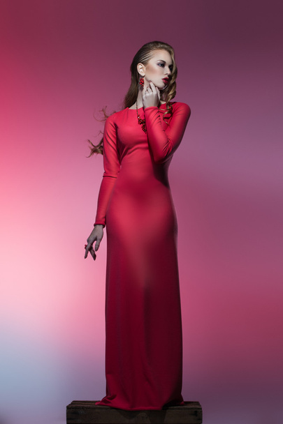 Beautiful woman in red dress - Foto, Imagen