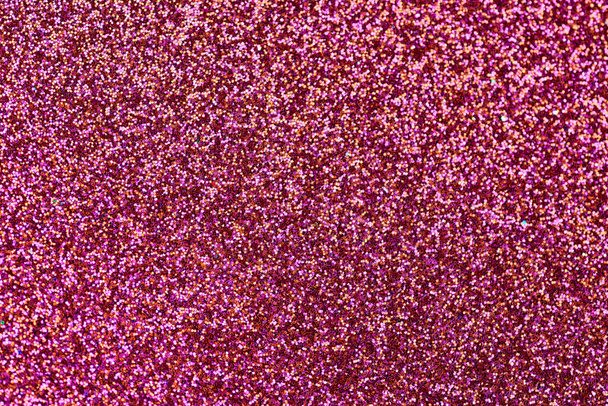 Scarlet red glitter texture. New Year or christmas background for greeting card. Valentines Day celebration. Shiny sparkle design for festive decoration: wedding, holiday or anniversary party. - Photo, Image